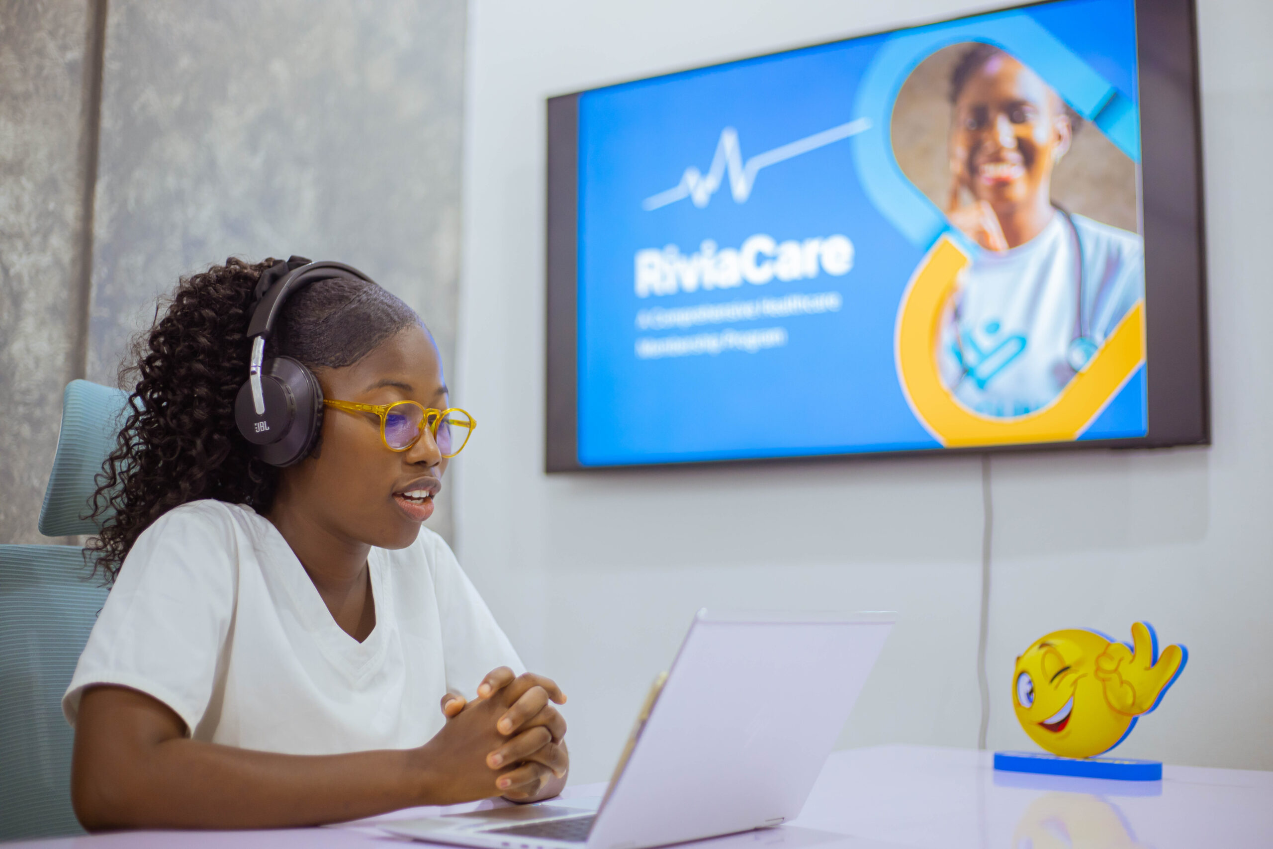 Annette Obiri Gyimah, A Rivia Nurse talks to a RiviaCare on the phone during consulation